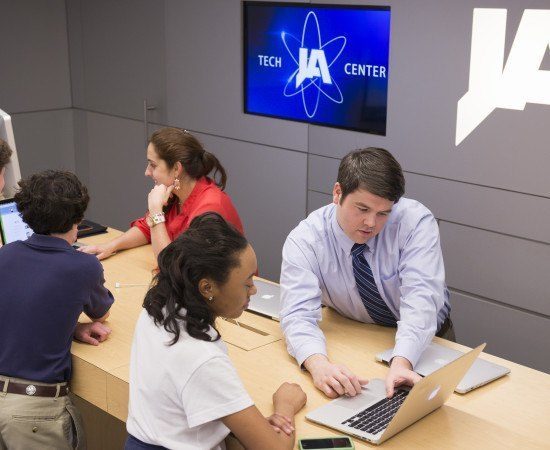 A student gets assistance at the technology center