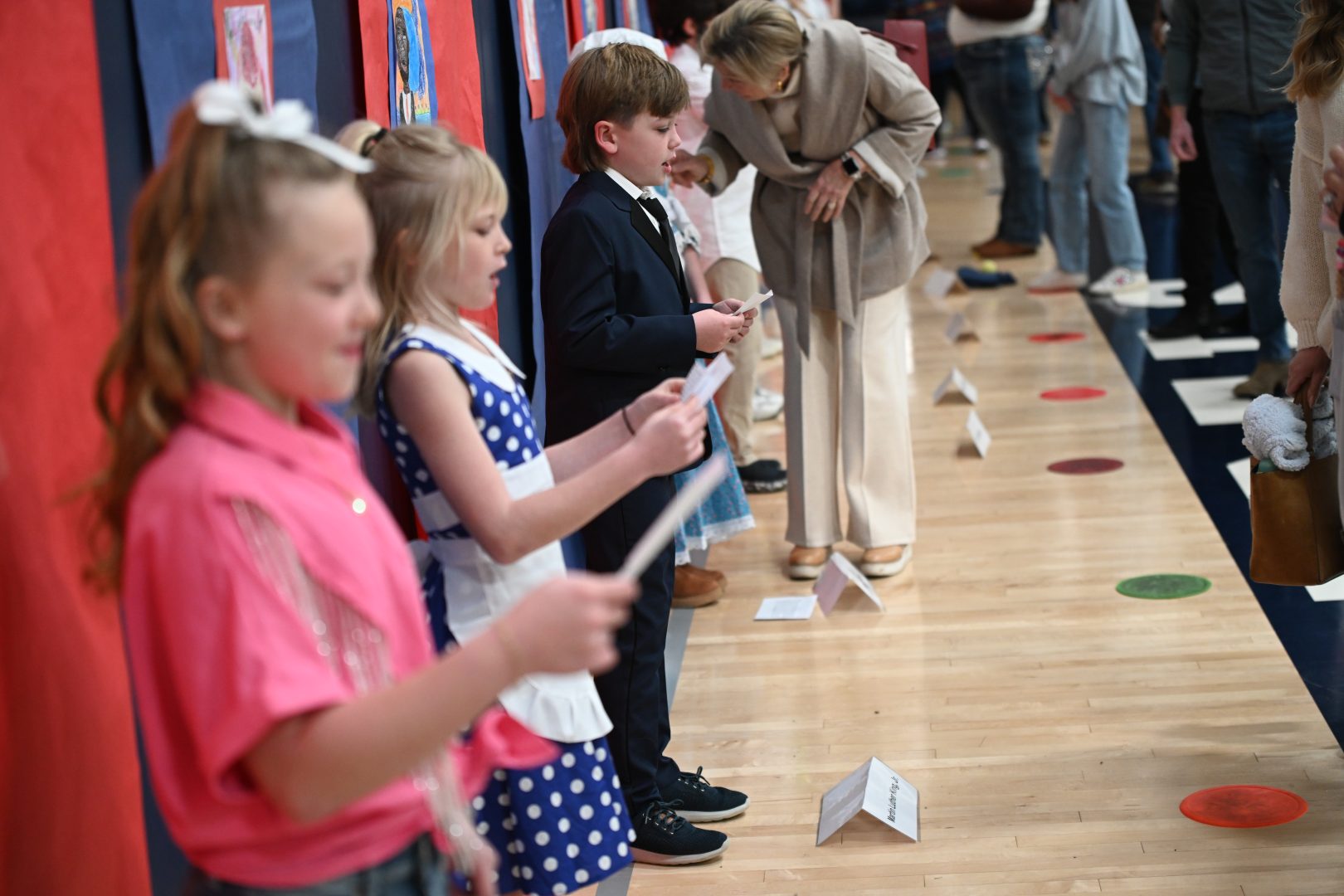 Students recite bios of famous Americans in a Wax Museum program at JA.